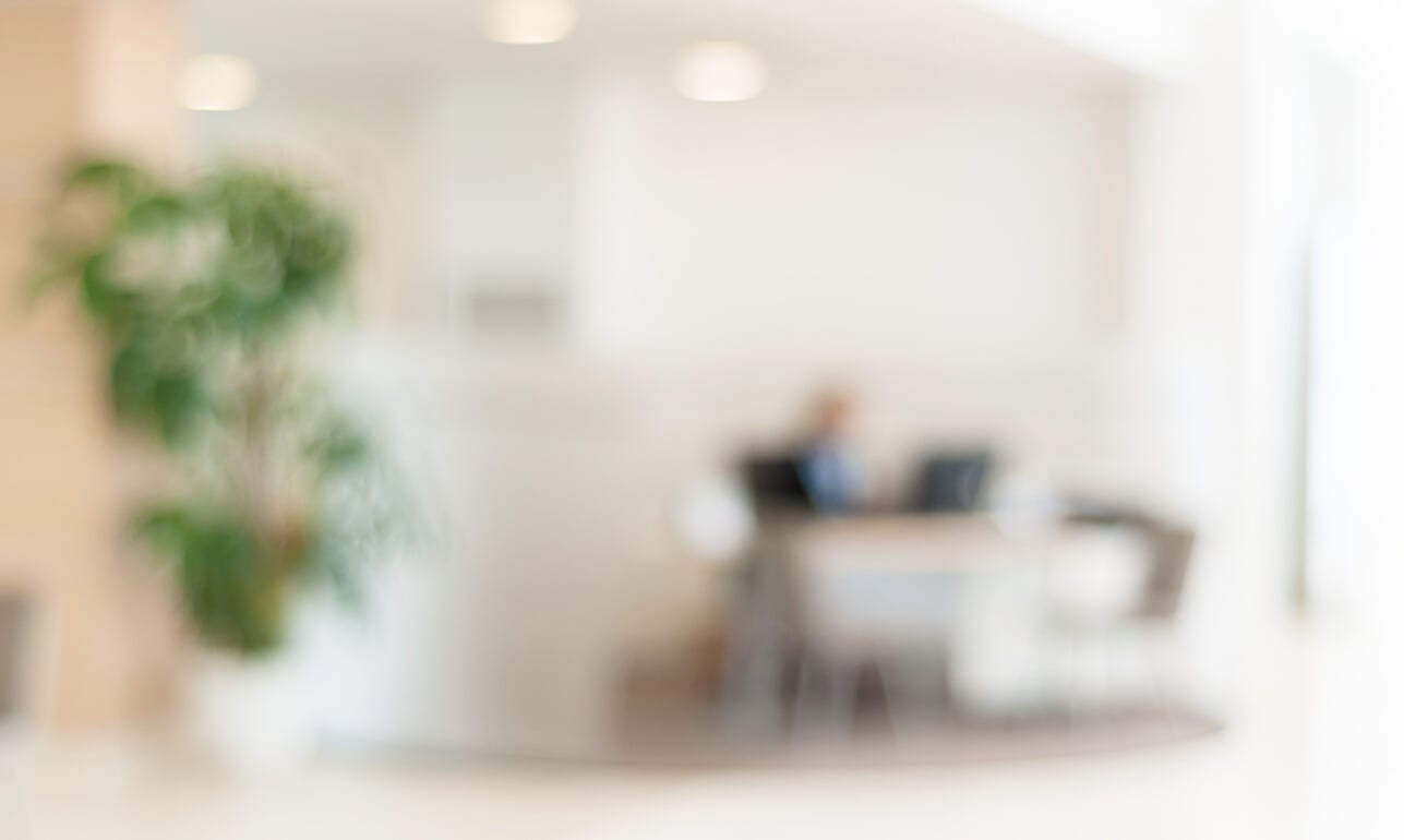 blurred office background , office worker on the computer